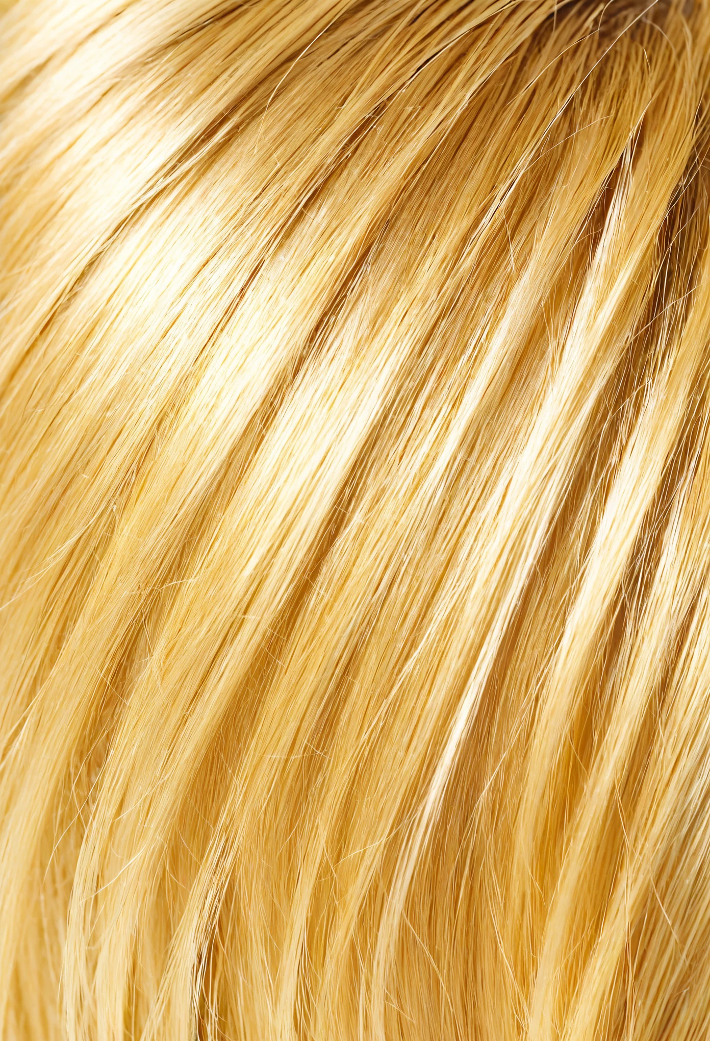 A blonde person is someone with hair that ranges in color from light gold to deep yellow., often with warm tones.