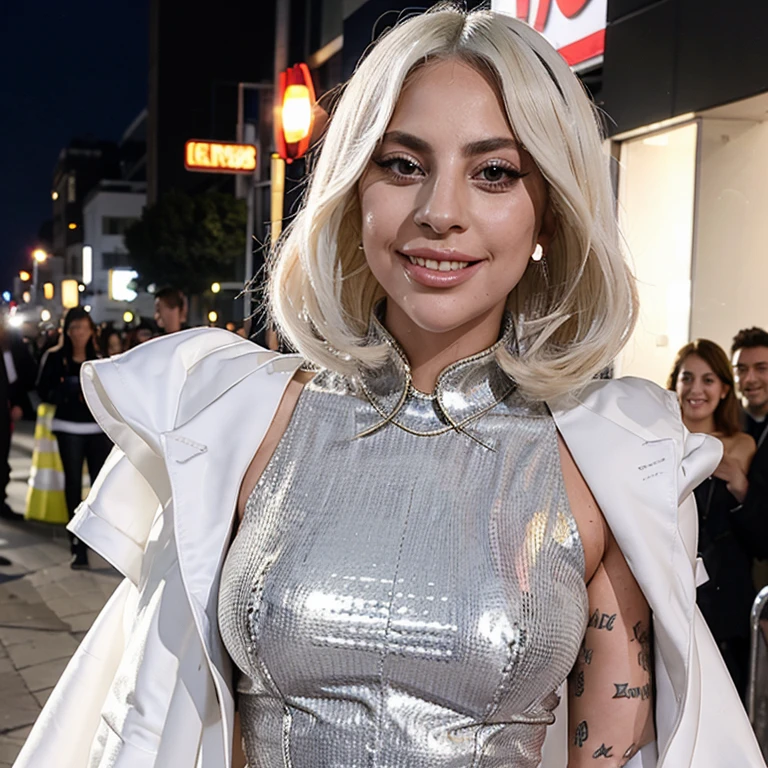 Lady Gaga dressed in light clothing smiling