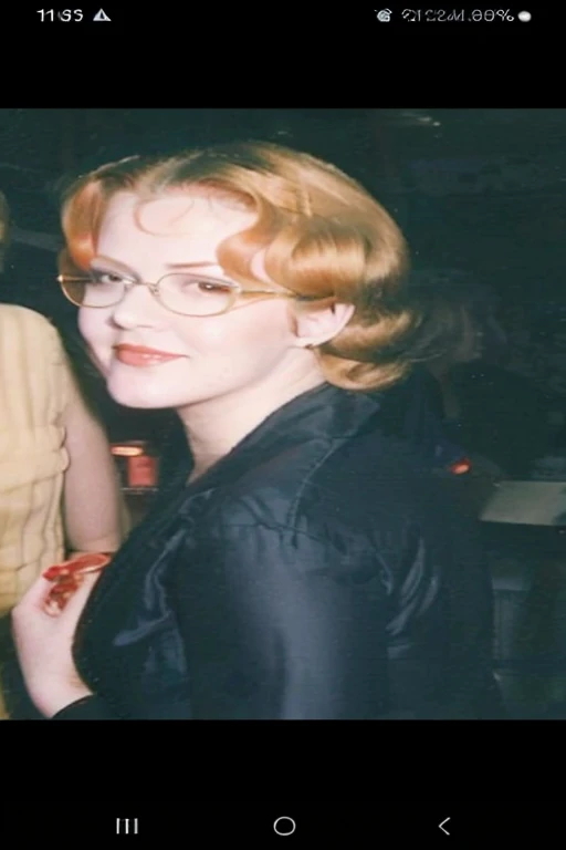 Retro pin up with orange hair and wearing glasses