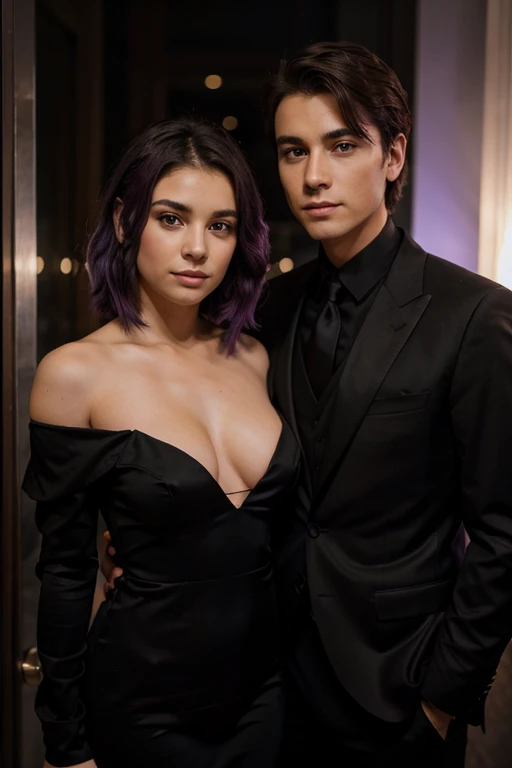 A young man with short brown hair in a black suit and a young woman with purple hair in a black evening dress stand together and look into the camera.