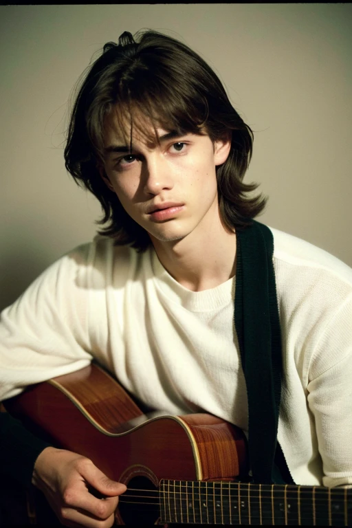 Photograph of a young man in his 20s (worried facial expression), textured skin, goosebumps, pale whitish skin, European features, attractive and youthful, wavy dark brown hair, shoulder length wavy hair dark shirt with green sweater, worn jeans, cowboy photograph, dark and mysterious. room with rock posters, perfect eyes slightly closed, similar to Björn Andrésen, Precision 6 String Acoustic Guitar: 1.2, Anatomically Correct Fingers, Acoustic Guitar, 1 Guitar Only. holding a guitar (candlelight, chiaroscuro). ), aesthetic, Porta 160 color, shot with ARRI ALEXA 65, bokeh, sharp focus on subject, shot by Don McCullin