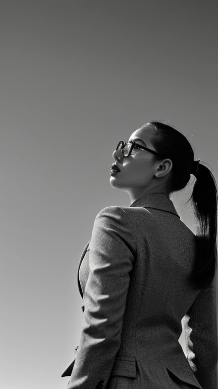 Subject: black and white, (((full-lenght))), dramatic portrait celebrating the successfully business of a young beautiful woman, with eyeglasses and hair in a ponytail, looking in camera
Creative descriptions: confident, determined, ambitious, professional, she wears a grey office suit
Environment: neutral background
Mood/feelings: empowerment and calm
Style: (((expressionism cinematic style))), with (strong contrasts), (((exaggerated angles))) and (((dramatic lighting)))
Camera settings: (((point of view: ground))), image taken by distance, (((High-angle shot))), wide lens, (((black and white film))), (((full-lenght portrait))), 8k, many fine details.
