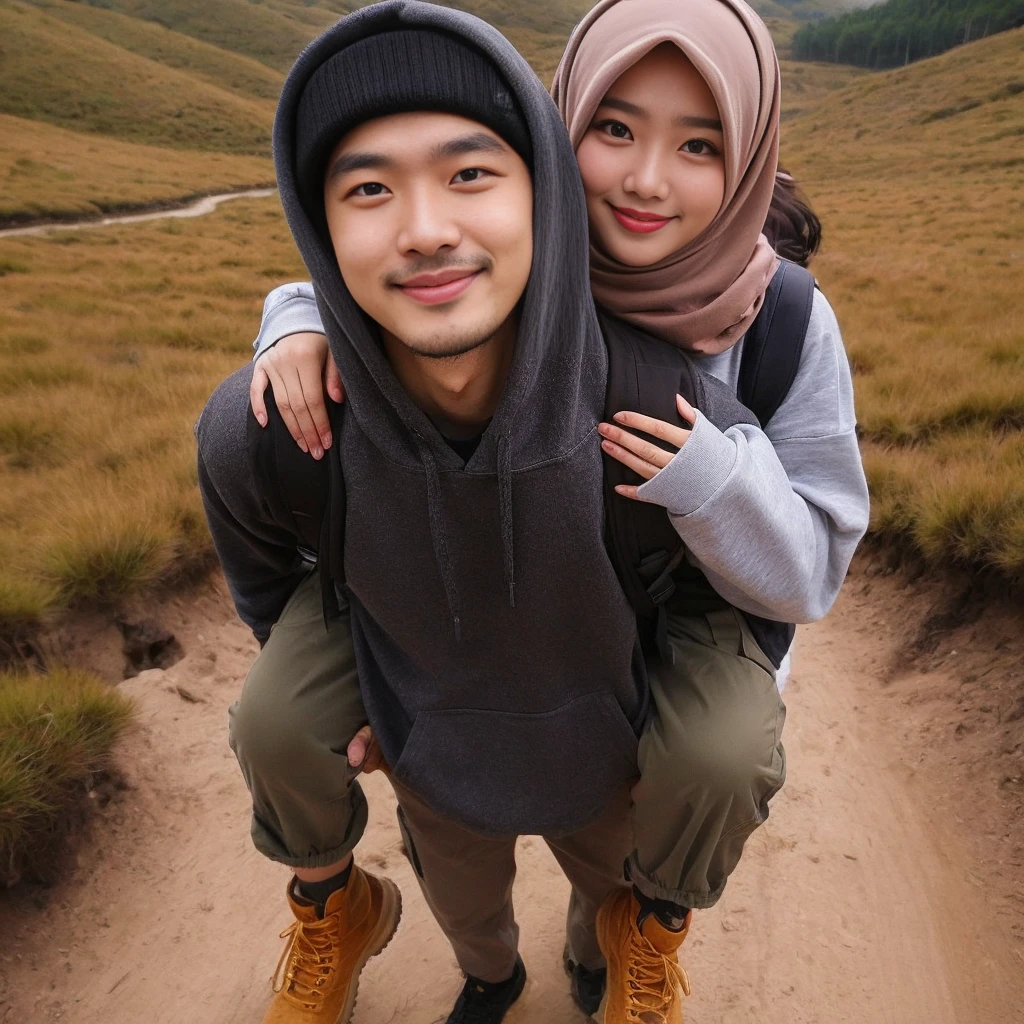 foto diambil dari atas, seluruh tubuh, fotografi, realistis, seorang pria Asia ((rambut berpotongan buzz, memakai topi beanie, wajah lonjong dan bersih, tubuh kurus, memakai jaket hoodie, celana kargo, sepatu bot coklat)), menggendongnya kembali seorang wanita cantik Asia ((hijab, pipi tembem)), keduanya tersenyum tipis, memandang ke arah penonton, di jalur pendakian yang menanjak dengan tanah dan bebatuan kecil, di sisi kanan dan kiri padang rumput, di kejauhan terlihat hutan tropis yang subur