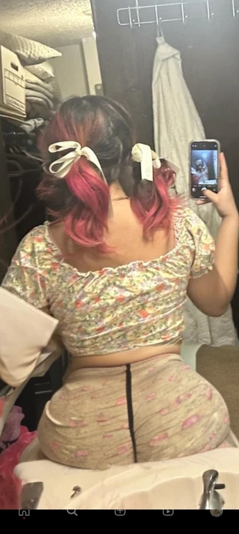 woman with pink hair taking a picture of herself in the mirror, wearing pink hair bow, pigtails, colorful pigtail, wearing underwear, with pink hair, wearing pink panties, back of the hair, roses in her hair, pink hair covered with hairpins, view from the back, curvy and bow, shot from the back, thick bow, insanely inflated hips, beautiful girl, big ass, huge ass, bbw, from behind, thick, thick thighs, wide hips, bbw, big , sideboob, giant ass, side view, big butt, round butt, tight underwear, underwear halfway off, underwear taking off, grabbing ass, ass spilling over underwear, too thick for clothes, side angle, chubby stomach, big , filipina, fat ass on sink