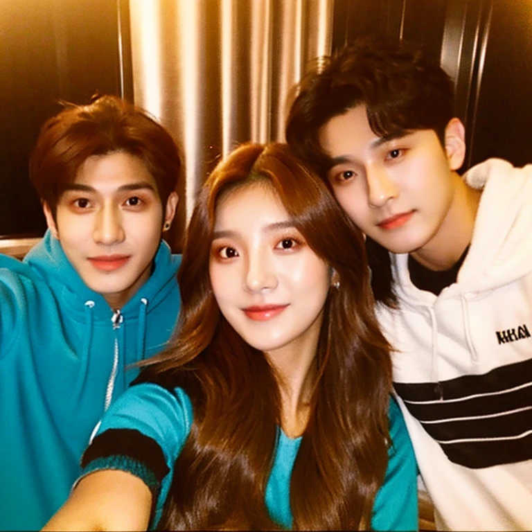 female kpop idol with brown hair taking a selfie with two kpop male idols
