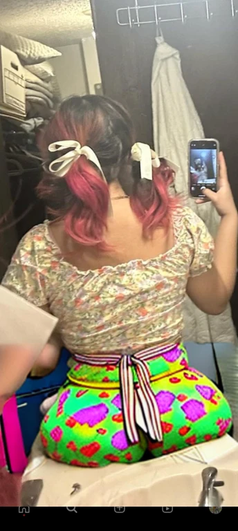 woman with pink hair taking a picture of herself in the mirror, wearing pink hair bow, pigtails, colorful pigtail, wearing underwear, with pink hair, wearing pink panties, back of the hair, roses in her hair, pink hair covered with hairpins, view from the back, curvy and bow, shot from the back, thick bow, insanely inflated hips, beautiful girl, big ass, huge ass, bbw, from behind, thick, thick thighs, wide hips, bbw, big , sideboob, giant ass, side view, big butt, round butt, tight underwear, underwear halfway off, underwear taking off, grabbing ass, ass spilling over underwear, too thick for clothes, side angle, chubby stomach, big , filipina, fat ass on sink, not nsfw