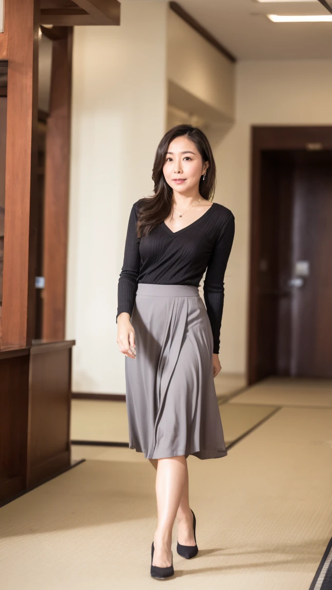 High resolution, highest quality, masterpiece, Textured skin, Anatomically correct, sharp, (((Full body photo))), (Shooting from the side), (Alone in the hotel lobby), (walking), ((Japanese Mature, 42 years old)), Nasolabial folds, Black straight hair, Semi-long hair, (Plump figure:1.1), Shapely small breasts, (Looking at the camera), Serious expression, (Business look), ((teacher)), Grey ribbed V-neck, Long sleeve, Formal tight skirt, pumps, necklace, Earrings