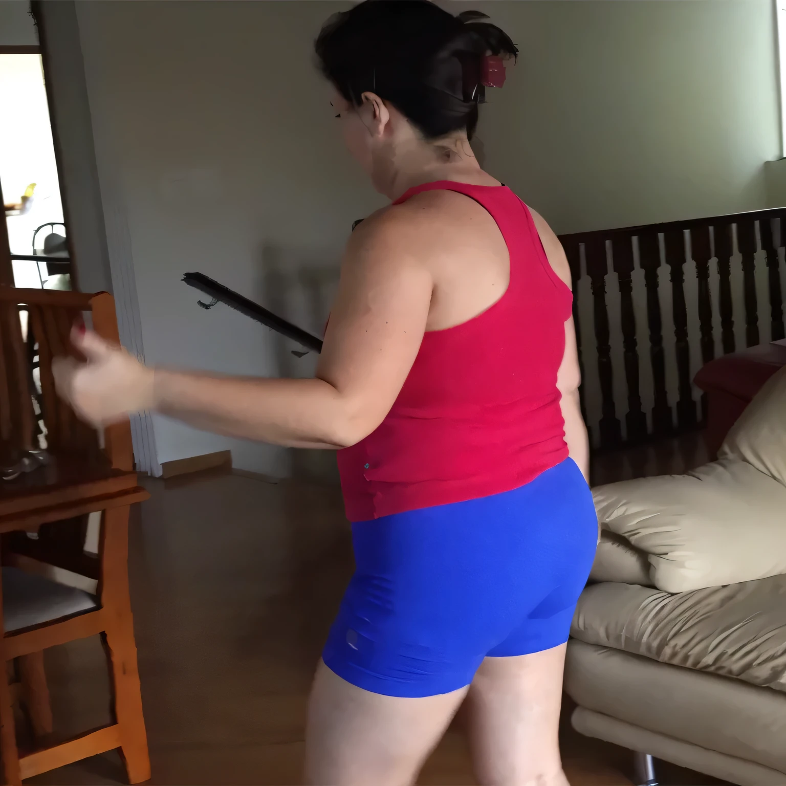 A beautiful light brunette woman, black hair, red tank top and blue shorts playing wii in the living room, attacking the camera: 4, leg and hip shot, photo taken from behind, her back is turned, side view of her taking steps . (ultra quality masterpiece) with toned body, 35 years old, 1.62 tall, 60 kg, best quality, perfect face, perfect mouth, perfect hands, (((black hair))), is standing, ( full body) wearing a tank top (((red top)) )), short blue shorts (((short blue shorts)))), dark brown hair, short blue shorts for gym training, tanned body, sexy pose, good legs shapely, well-defined, high contrast, Ultra HD, high contrast, 16K. photorealistic, detailed and realistic hands, 5 fingers per hand, alone, dark hair, green thong bikini, full body photo, clear, high quality photo. Beautiful woman, extremely sexy, very sensual. Masterpiece: 1.3, high resolution, (photographically realistic), 8k, NUDE, NUDITY, NFSW.