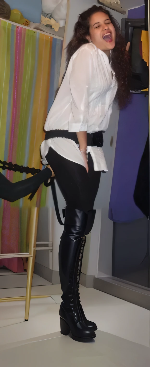 wearing black riding boots, legs crossed