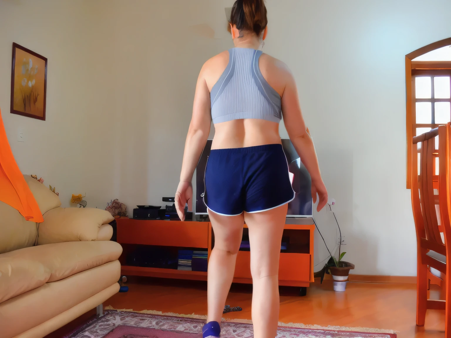 there is a woman standing on a rug in a living room, sport bra and dark blue shorts, sport bra and shorts, long shot from the back, long shot from back, back - shot, from back, back pose, back shot, seen from the back, back arched, hunched shoulders, backview, skinny female artist back view, from the back