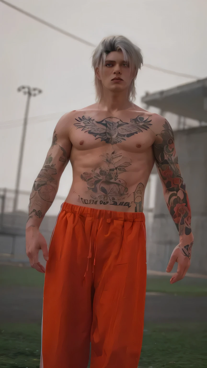 white haired man with tattos with shirtless prison outfit standing in prison courtyard