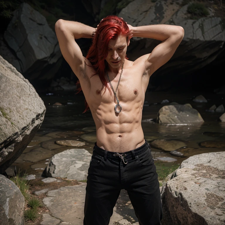 Very skinny weak looking man chained to a rock in only his pants with long red haie