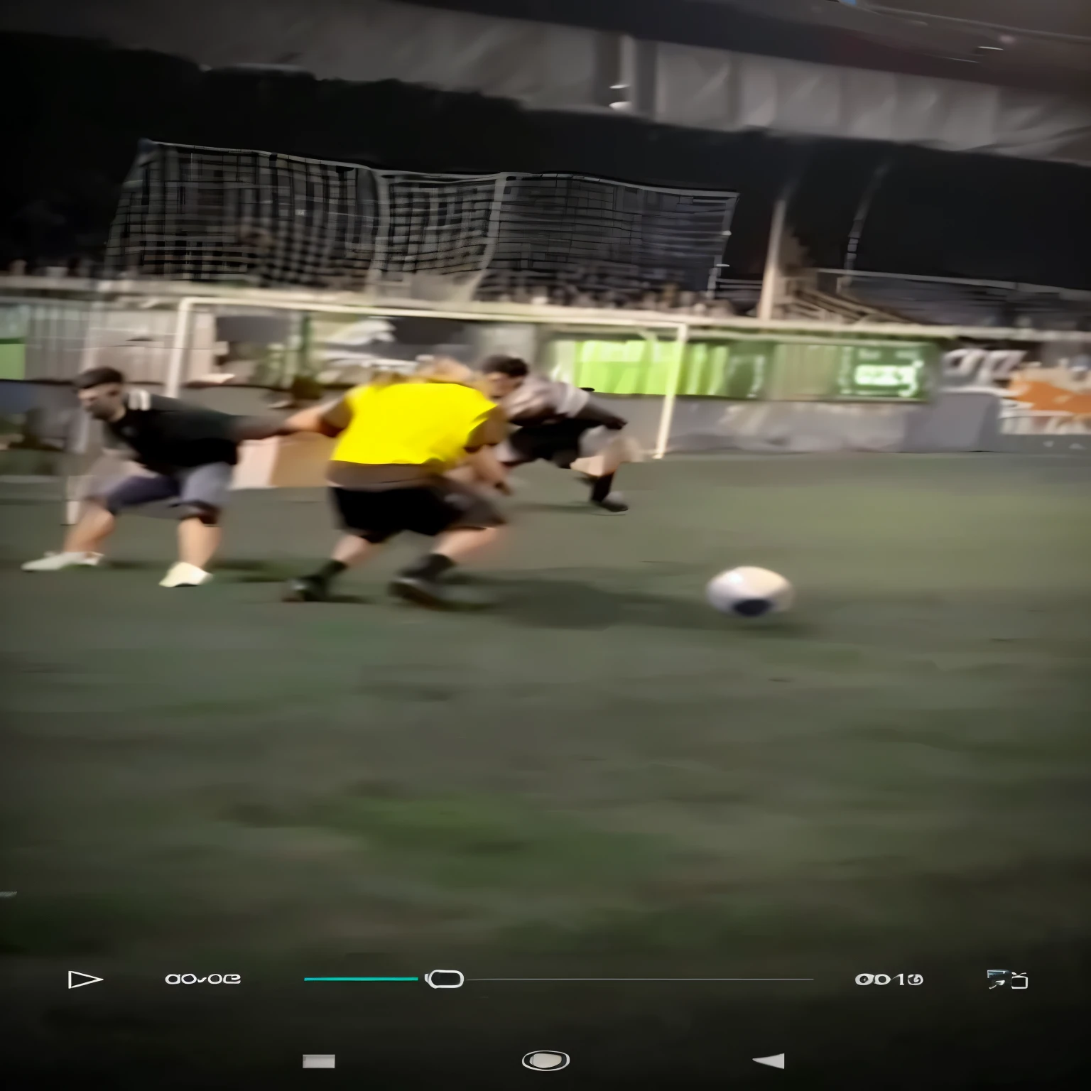 there are two men playing futebol on a field at night, playing futebol, drible, dribbling tendency, filmagem do jogo, filmagem de baixa qualidade, low quality video, instagram post, screenshot of youtube video, tiro de abertura, stadium clip, filmagem granulada, filmagem ao vivo, imagens de jogo,  post, drible popular, capturar, futebol, tiro voador, filmagem borrada  aprimorar qualidade 