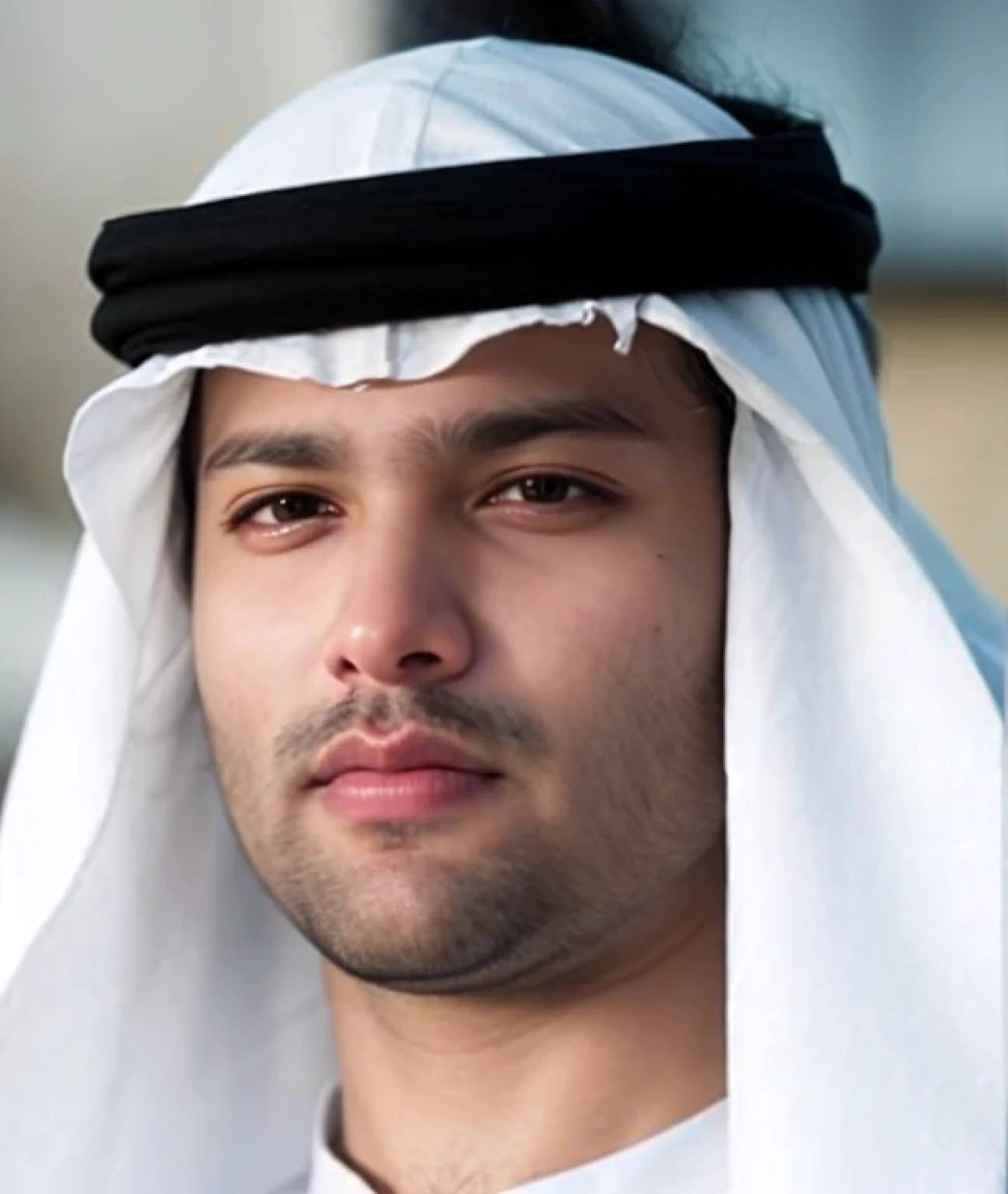 A beautiful young bearded man with highly detailed skin looking at the camera,8k,high res, soft light,no contrast,ultra realistic, photorealism.((real life photo,realistic:1.9, short beard:1)),(wearing black sherwani),((closeup shot:1.5))