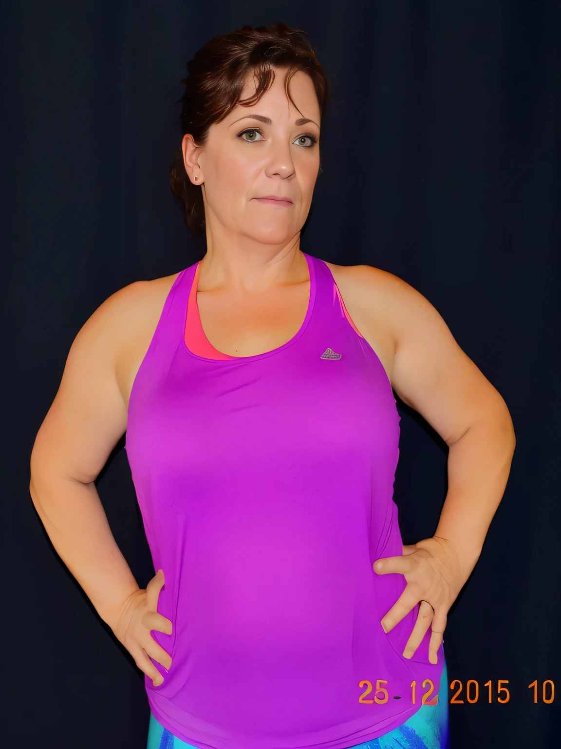 there is a woman in a purple tank top posing for a picture, frontal pose, wearing purple undershirt, fit pic, sweating intensely, sweating, t pose, folds of belly flab, 40 years old women, her face flushing and sweat, half-body shot, half - body shot, 40 years woman, violet tight tanktop