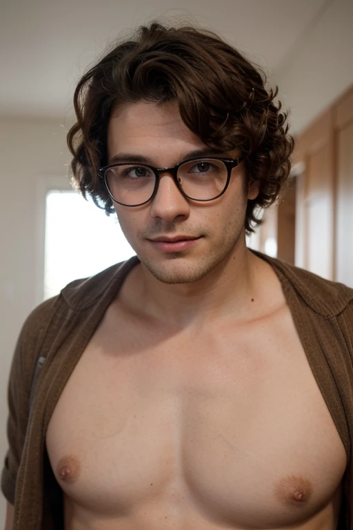 Young man with curly hair, shaved beard, glasses, brown,