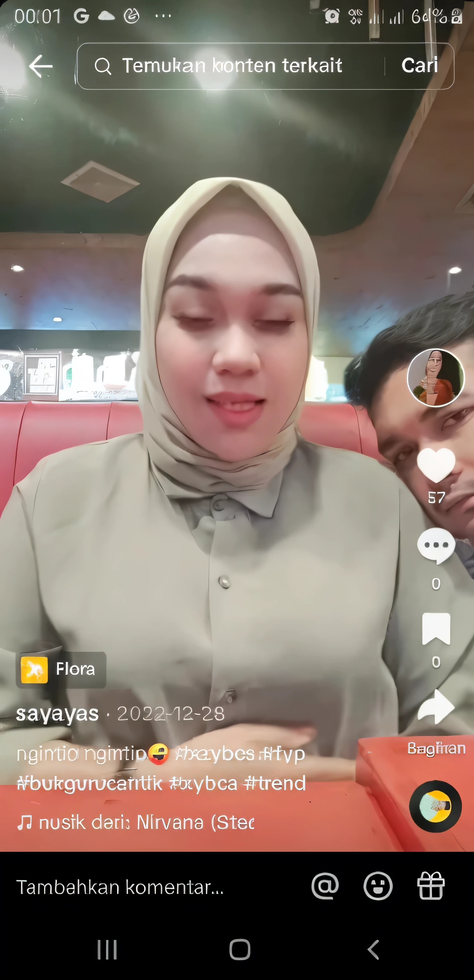 there is a woman sitting in a red chair with a man, tiktok video, low quality video, live footage, instagram story, with funny feeling, with instagram filters, front camera, iphone video, instagram filter, appearing in a shopping mall, real footage, post, instagram picture, hijab, captura, youtube video screenshot, hurufiyya