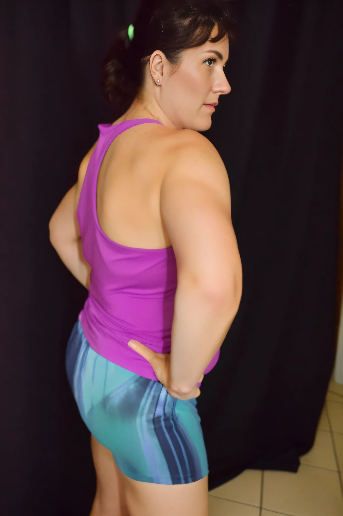 woman in a purple tank top and blue shorts in front of a black curtain, arms to the side, arms behind the back, left arm and back lowered, insect forearms bent, side pose, shoulders hunched, muscles swollen, showing shoulder ??????????? , photo taken ???????????, toned arms, 3/4 side view, flexing big muscles, making sassy pose, 40 year old woman, sarcastic full body pose, photo shoot, ???? pose. Shapely woman in purple top and blue shorts posing for a photo, arms to the side, half-length photo, tight photo, half-length photo, half-length photo, violet tight top, half-body close-up, portrait photo of full body, full body and headshot, full body photography, centered full body photo, 40 year old woman, 4k, portrait photo, light violet tank top, profile photo, sweaty face, 3/4 solo portrait, photo suitable, black background. She is wearing a vibrant pink-purple sports tank top and mixed shorts (((blue-gray-green-black))), suggesting an active lifestyle or athletic attire for working out. Sharp photo, high quality, high resolution (ultra quality masterpiece), Ultra HD, high contrast, 16K. Masterpiece: 1.3, high resolution, (photographically realistic), ????, ??????, NFSW.