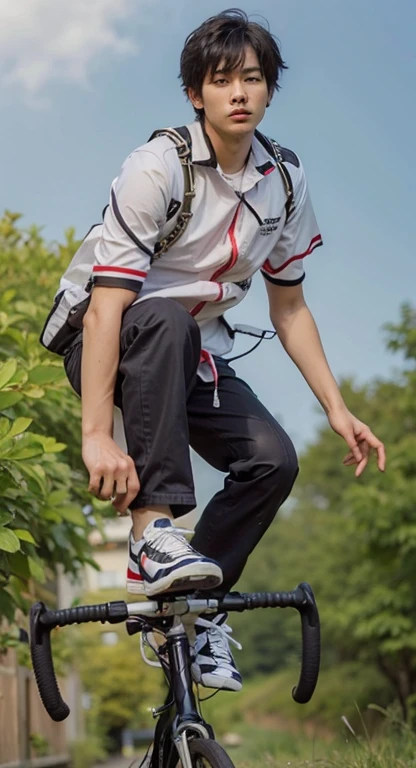 boy with balck hair standing on bicycle