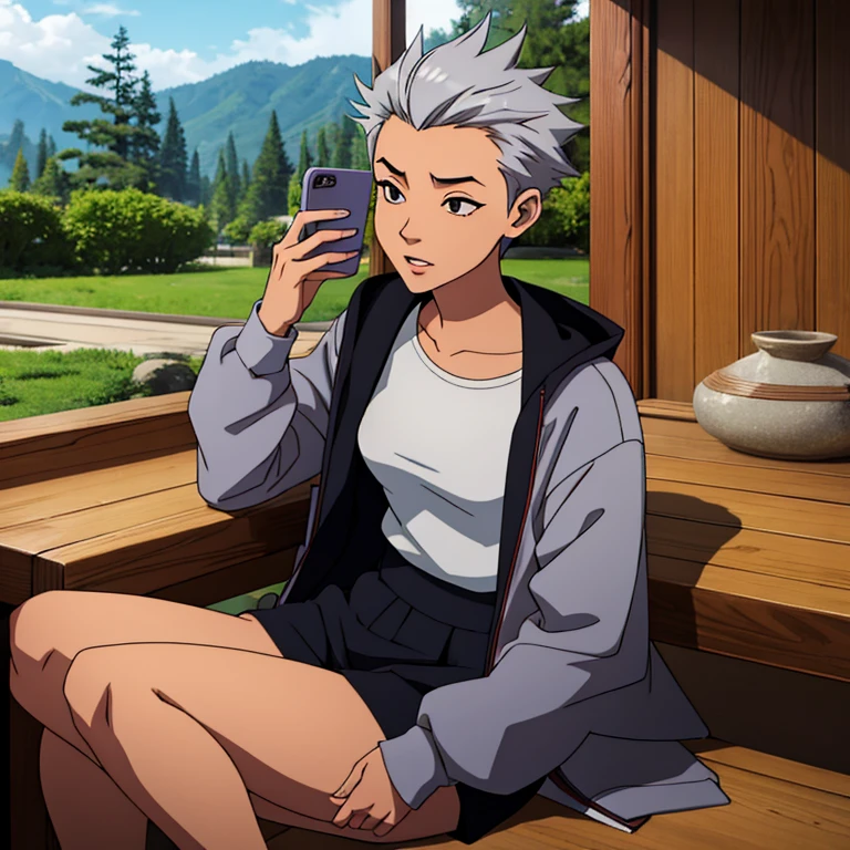 Japanese young woman with spiky silver hair, loose jacket, on her phone.
