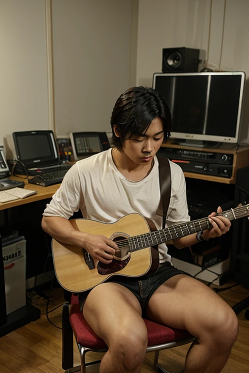 Cute asian sexy man with guitar sitting on chair writing song in studio room/Melancholic tone / bust