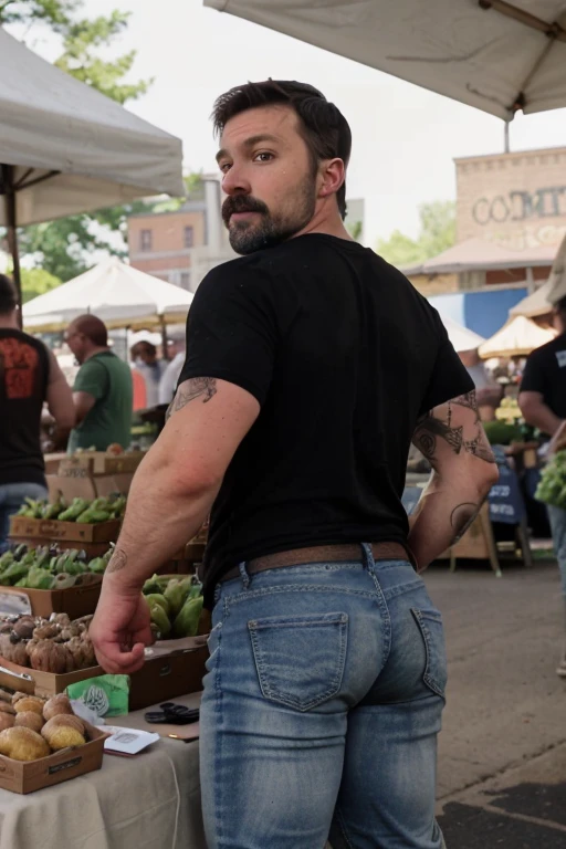 JordanBrandt, 45yo, short mustache and beard, wearing a t-shirt and  jeans, at the farmers market, backside bent over 