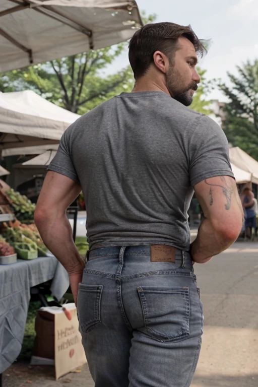 JordanBrandt, 45yo, short mustache and beard, wearing a t-shirt and  gray jeans, at the farmers market, backside bent over walking