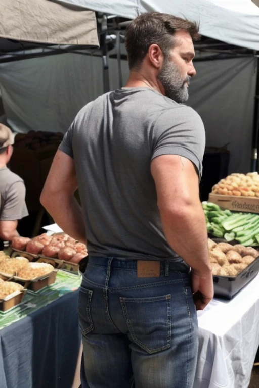 JordanBrandt, 45yo, short mustache and beard, wearing a t-shirt and gray jeans, at the farmers market, backside bent over 