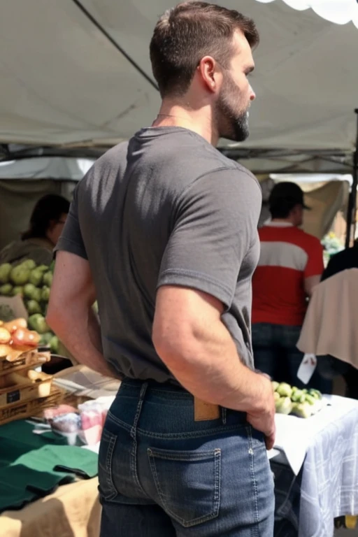 JordanBrandt, 45yo, short mustache and beard, wearing a t-shirt and gray jeans, at the farmers market, backside bent over 