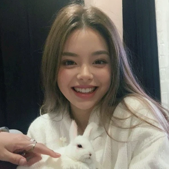 beautiful smiling girl,thin face,beautiful teeth,big pink lips,dark brown hair,hands touching a white rabbit,thin nose,big eyes,happy,no wrinkles,(best quality,4k,8k,highres,masterpiece:1.2),ultra-detailed,(realistic,photorealistic,photo-realistic:1.37),HDR,UHD,studio lighting,soft focus,professional,vivid colors,portraits,soft pastel colors,warm lighting