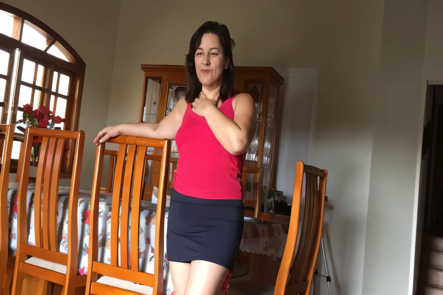 there is a woman standing in a room with a chair, photo from the back, 3 0 years woman, shoulder in front pose, wearing a camisole, photo shoot, sitting on a table, woman posing, sitting on bent knees, 4 5 yo, the extremely hot and sexy, 30-year-old woman from Brazil