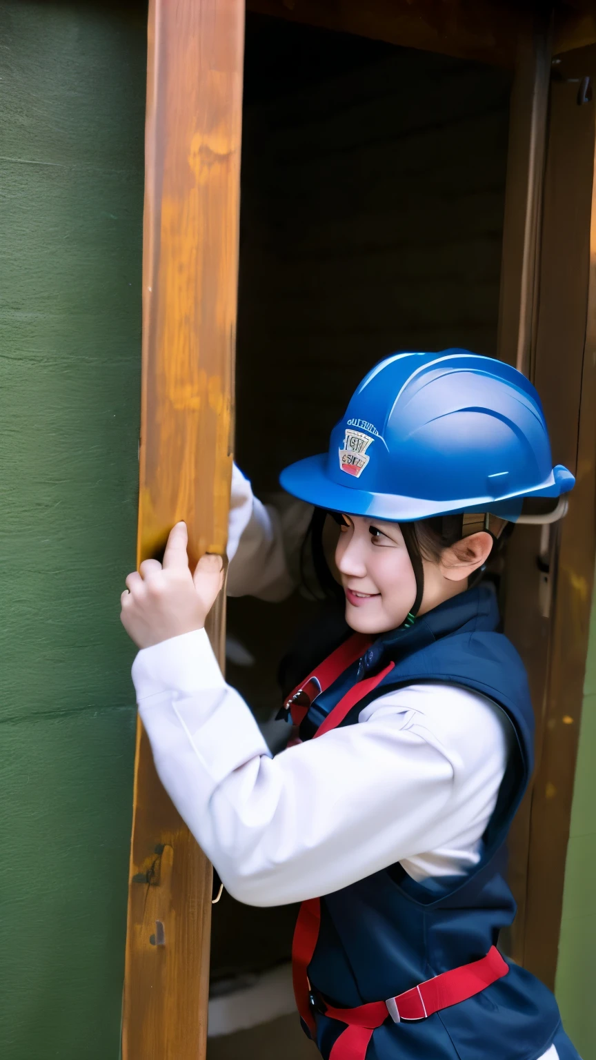 A firefighter taking off her bunker gear