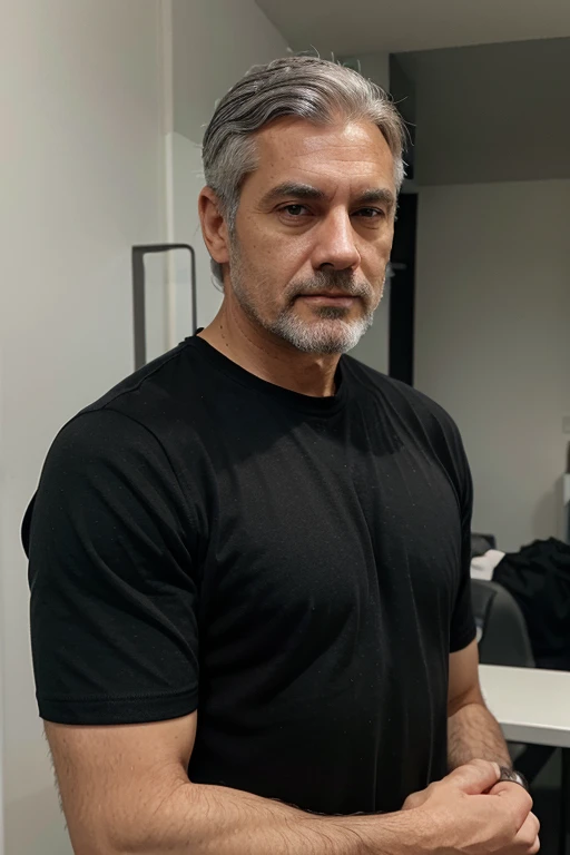 Man in his 40s with gray hair in black shirt 