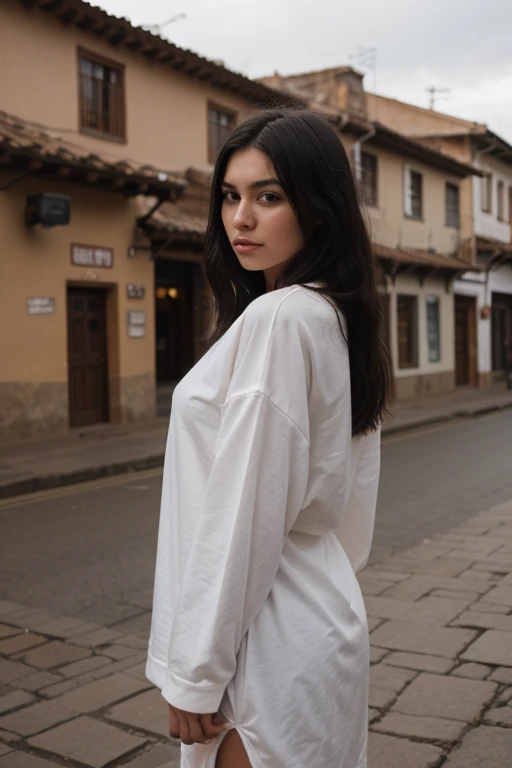 Girl with black hair emo pretty and real looking with oversized clothes in landscapes of Cusco - Peru