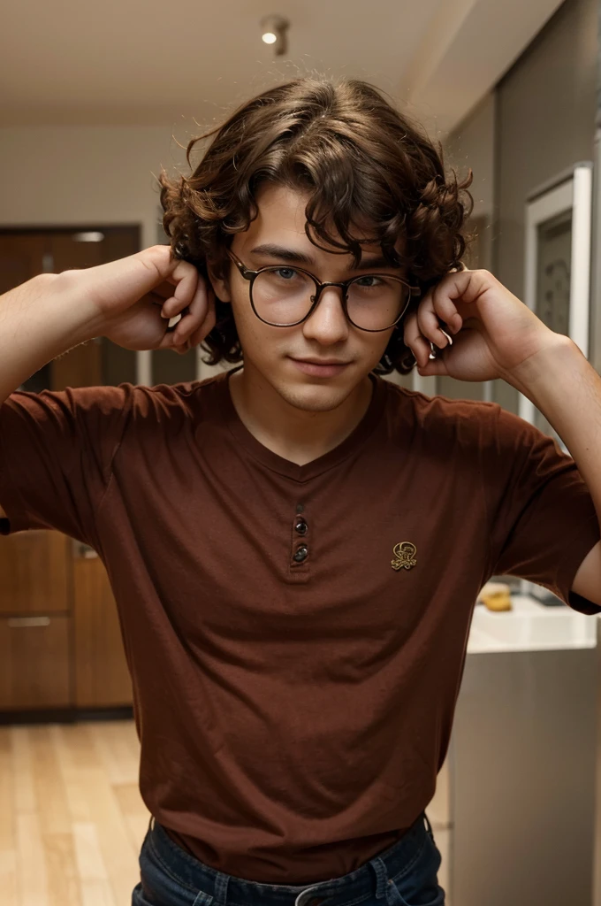 A 20 year old good looking boy having curly hair wearing glasses and a watch on his hand with a deep colour shirt.