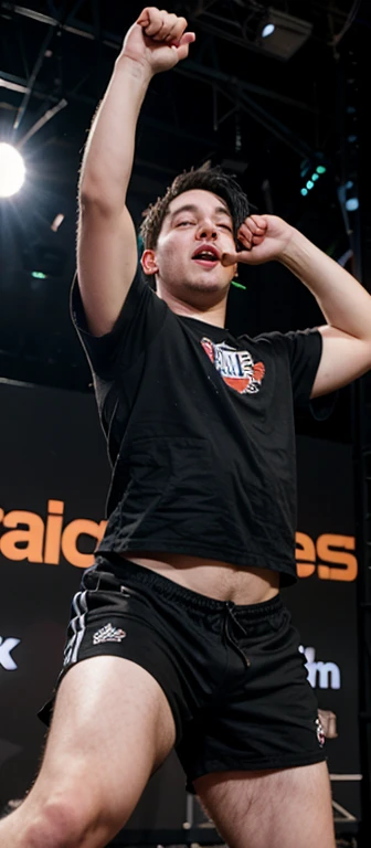 18 year old slightly overweight guy with black hair on stage at a rap battle