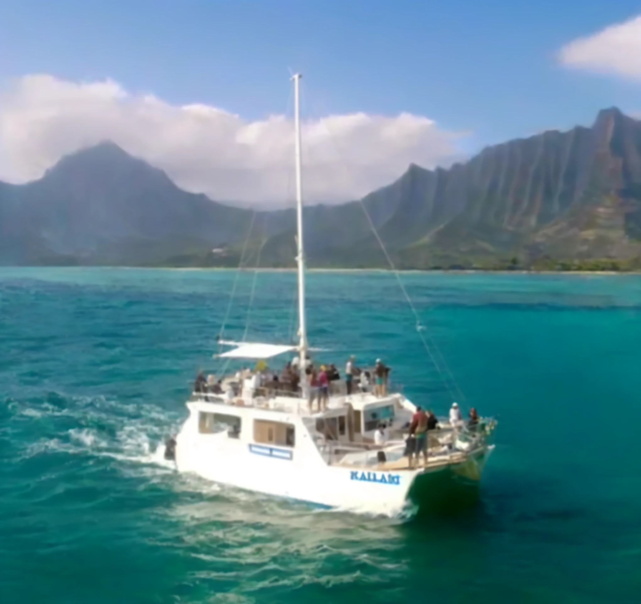 arafed boat with people on deck sailing in the ocean, kauai, 8k h- 0, ( ( ( kauai ) ) ), big island, ( ( ( ( kauai ) ) ) ), on the ocean, stunning view, bottom - view, beautiful views, 4 0 9 6, mana, hawaii, wide overhead shot, boat in foreground