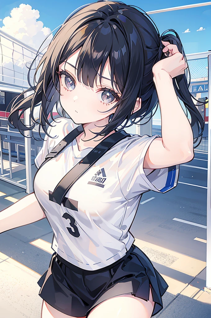 A beautiful girl with black bob hair playing volleyball