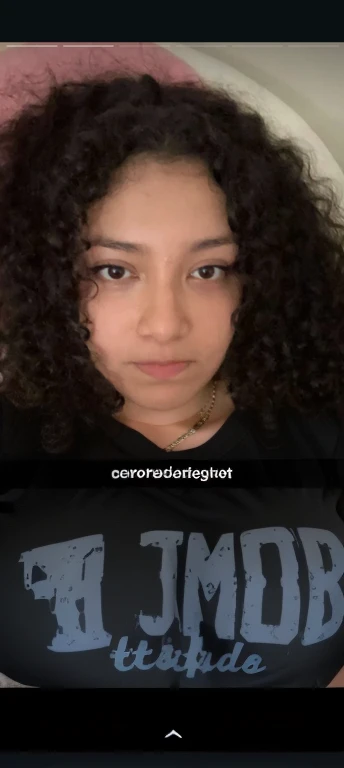 there is a girl with a black bra and a necklace on, curly haired, curly, curly hair, curly afro, curly dark hair, her face framed with curls, curly long hair, curly bangs, fair curly hair, curly black hair, black curly hair, long dark curly hair, messy curly hair, no makeup wavy hair, long curly hair, long black curly hair, Big tits, huge tits , no clothes, sexy, cute, minimal clothes, thick, bbw, chubby stomach, thick nipples, nipple piercings, large areola, hard nipples, piercing through shirt, nipples hard through shirt, busty, major cleavage, naked, ripping through top, spilling over sides, bra too tight, giant , extra wide hips, upper body zoom in, showing off huge , fat stomach, see through top, fat bbw, large areola showing, major cleavage, latina, down to stomach, wide hips, sexy, upper body zoom, thick arm, showing off , top half only, showing only upper, only a bra, showing off cleavage, naked, big tits showing, big  out, no clothes