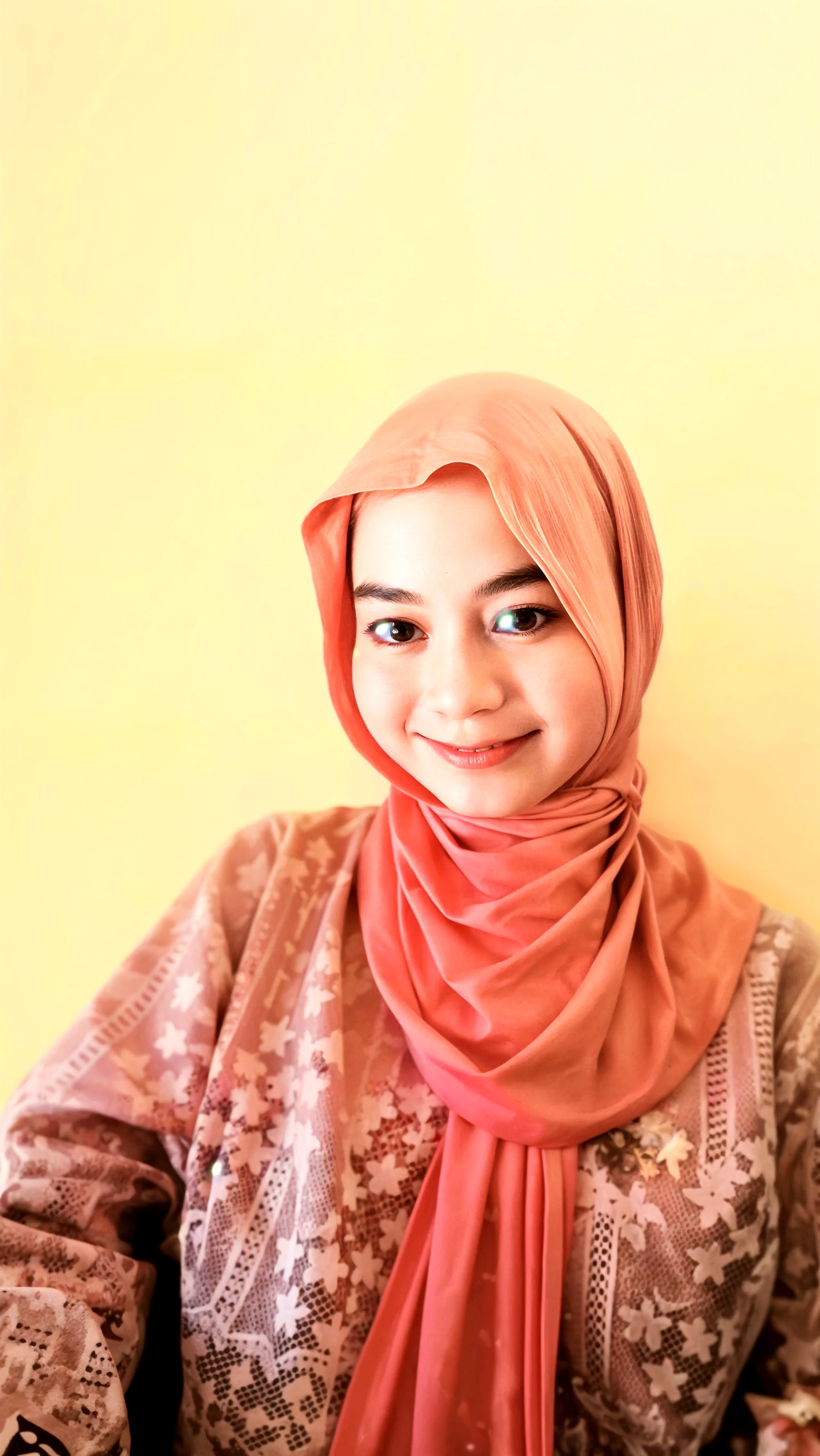 A beautiful Indonesian girl, smooth white skin, well-groomed face,wearing a brown hijab in a modern style,wearing a red orange knitted hoodie, smiled faintly,posing next to a purple orchid in full bloom. Soft fractal background .Realistic original photo 