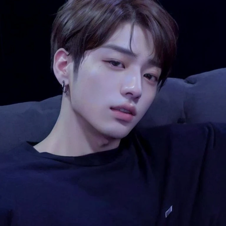 arafed man sitting on a couch with a remote in his hand, jungkook, cai xukun, jimin\'s right eyelid swollen, accurate jimin face, hyung tae, taejune kim, taken in the early 2020s, kim doyoung, jimin\'s plump lips, shin jeongho, wan adorable korean face, Jungkook face