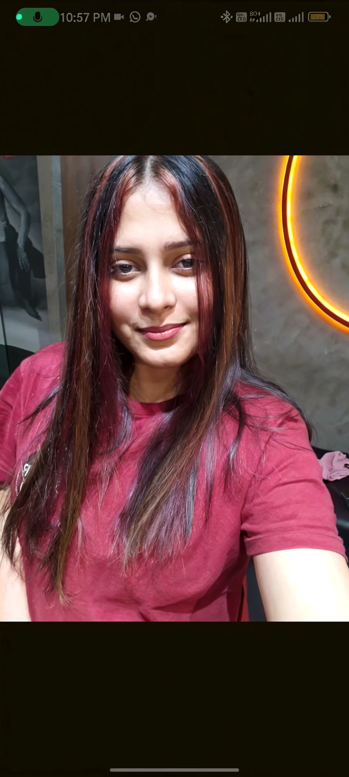 Selfie of young chubby Indian girl with red hair and fair complexion model pose side profile