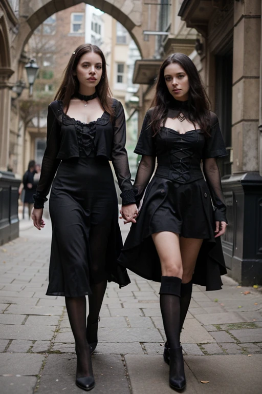 Two woman in gothic clothes in a place with gothic design