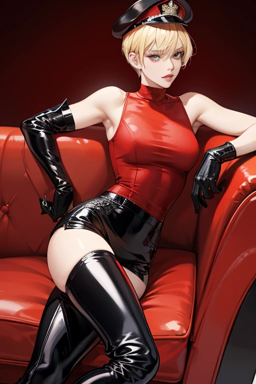 A blonde short-haired mature woman wearing a red patent leather tank top, black patent leather pants, black patent leather knee-high boots, red patent leather gloves, and a black military cap.