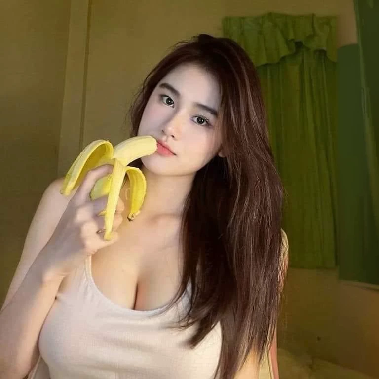 There was a woman holding a banana in her hand., With a new beauty, young and cute girl, sexy girl, good girl, 18 years old, She is about 20 years old., She is about 20 years old., 22 years old, Asian girl, 19 year old girl, Thai anime girl, Korean girl, 21 years old