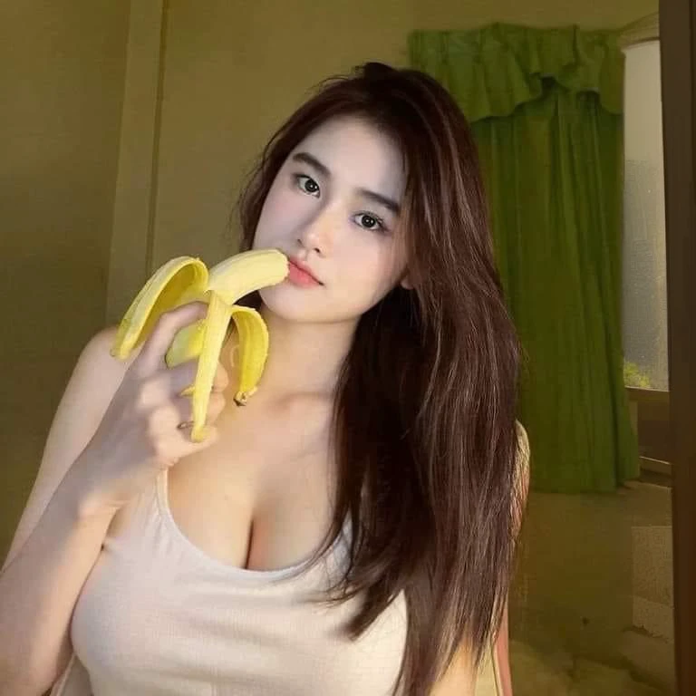 There was a woman holding a banana in her hand., With a new beauty, young and cute girl, sexy girl, good girl, 18 years old, She is about 20 years old., She is about 20 years old., 22 years old, Asian girl, 19 year old girl, Thai anime girl, Korean girl, 21 years old