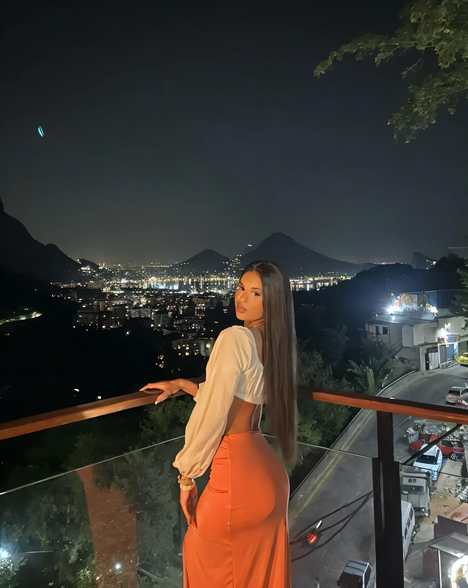 Woman in a black sexy just slit dress in a place at night