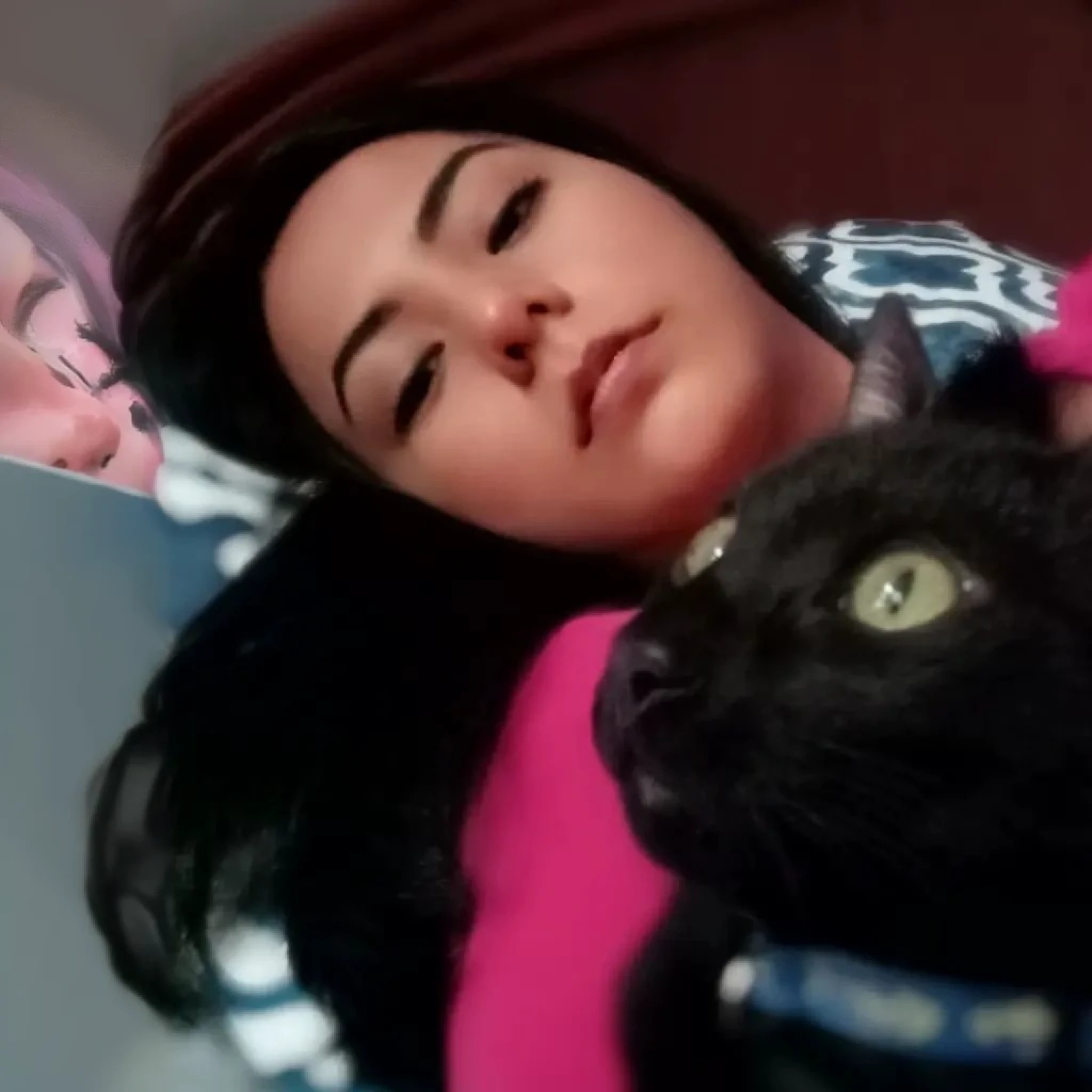 woman laying in bed with a black cat and a pink shirt, with small cat on lap, emo girl and her cat, woman and cat, black cat taking a selfie, with cats on her side, big cheeks holding her cat, she is laying on her back, she is holding a cat in her arms, laying on her back on a bed, laying on her back