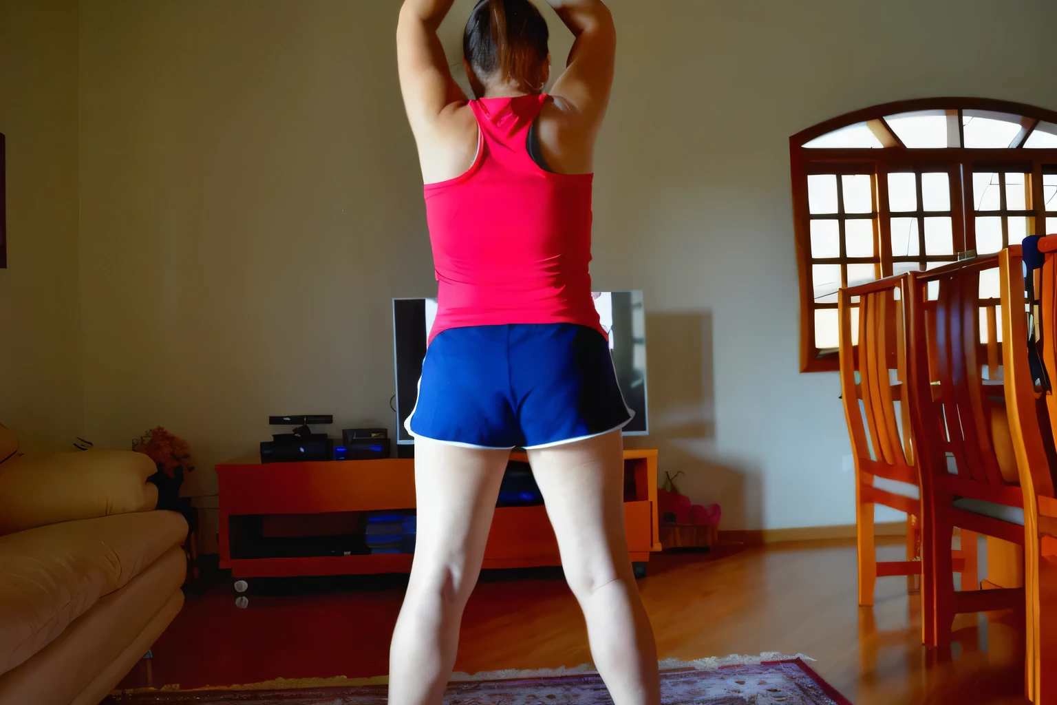 In the image, a beautiful Brazilian woman with white skin, dark brown hair tied in a ponytail, wearing a red tank top and tight blue shorts, blue shorts, she is in a room, with her back to the camera, wearing a red top and dark blue shorts . back photo, back pose, general shot of the back, back shot, photo from behind, standing athletic pose Rear photo, training, arms raised. Fitness woman, perfect arms, perfect body. She is around 40 years old, 162 cm tall and weighs 56 kg. Her body exudes glamor and her face is a definition of beauty. Slender body, thin waist. Highly realistic, hyperrealism, very elaborate skin, high quality photo. Sharp Photo, High Resolution, High Quality, Masterpiece, 16K Photo, Sharp Photo, High Contrast, Masterpiece, (Photographically Realistic), NUDE, NUDITY, NFSW.
