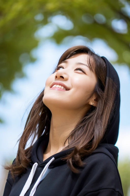 Girl in black hoodie, Japanese, cute older sister, brown hair color, semi-long hair, looking up at photographer, under blue sky, in park square, smiling